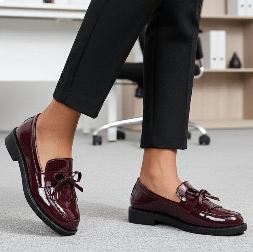 Burgundy loafers worn with black slacks 