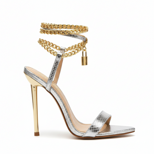 Silver high-heeled sandals with gold accents 