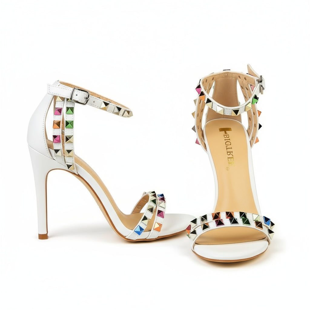 White high-heeled sandals with colorful studded details 