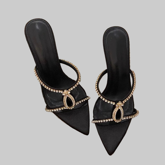Black high-heeled shoes with decorative elements
