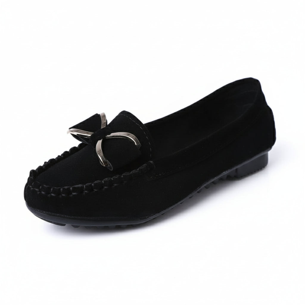 Black loafer shoe with a bow detail on a white background