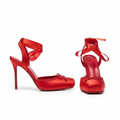Red high-heeled shoes with bows