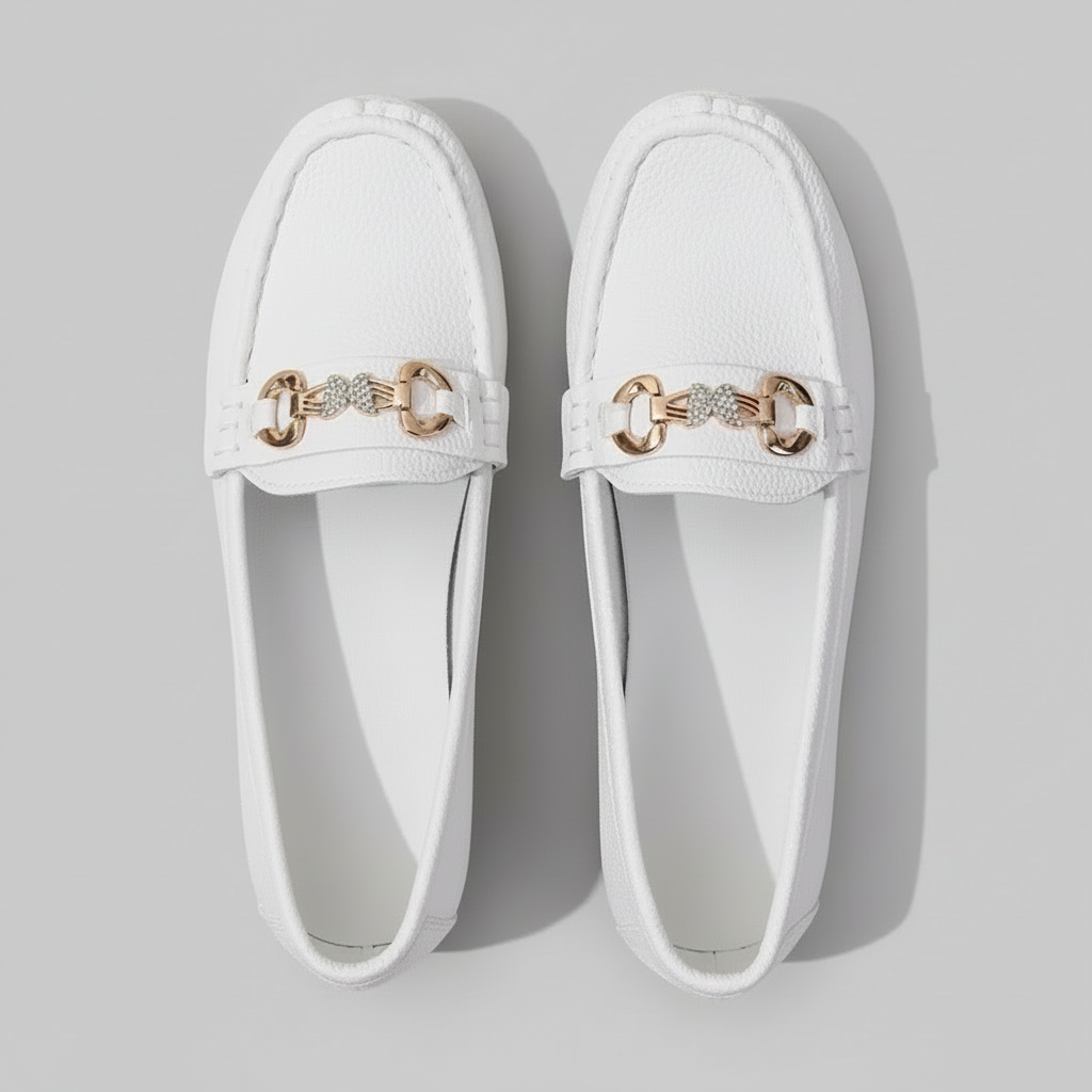 White loafers with gold accents 
