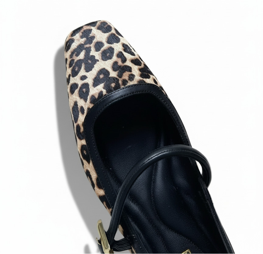 Leopard print flat shoe on a light gray background