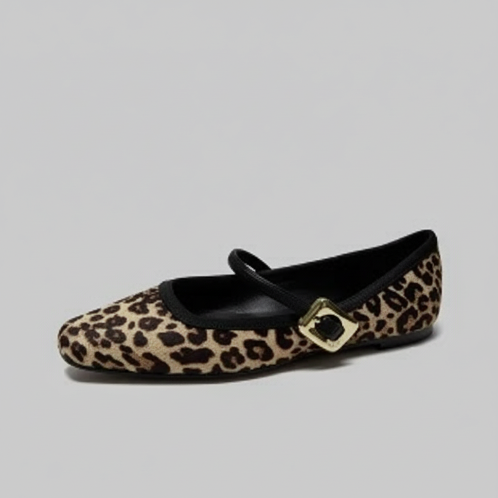Leopard print flat shoe with a gold buckle.