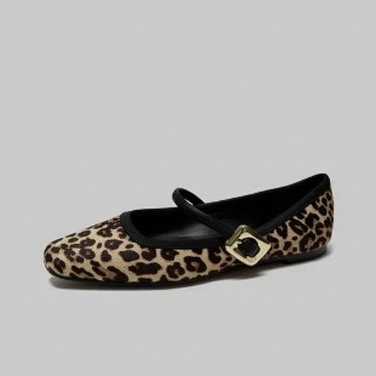 Leopard print flat shoe with a gold buckle.
